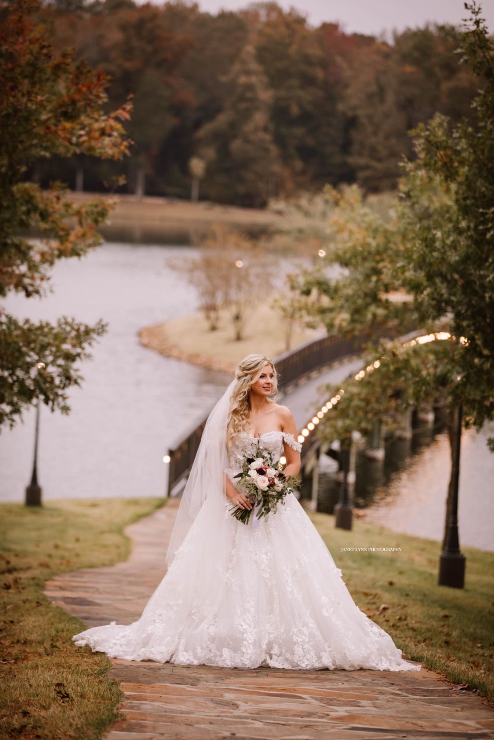 Bride on bridge to Islandsandy creek farms springville tn wedding venue sandy creek farms