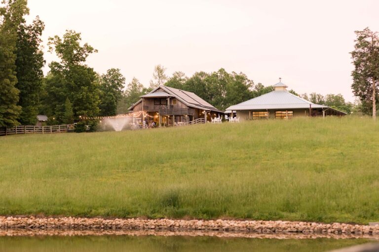 The Stables and Pavilion beside the lake at Sandy Creek Farms